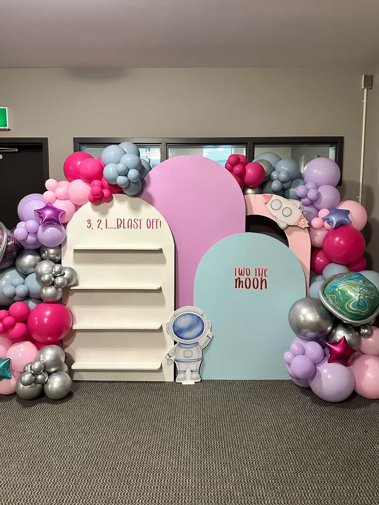 Balloon backdrop with organic garland at a Winnipeg celebration