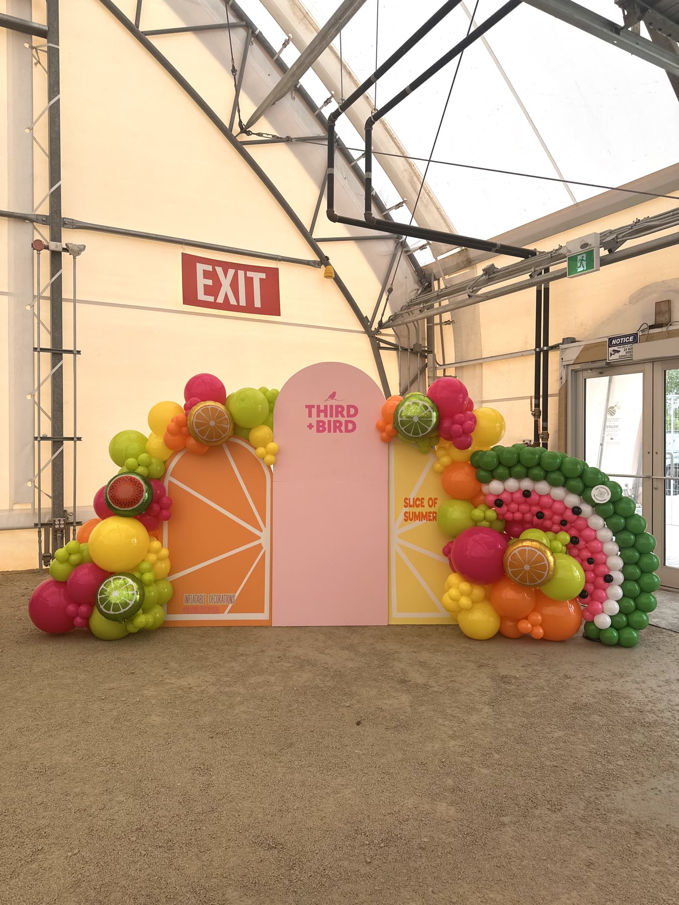 Balloon backdrop with a custom organic garland by Inflatable Decorations, Winnipeg
