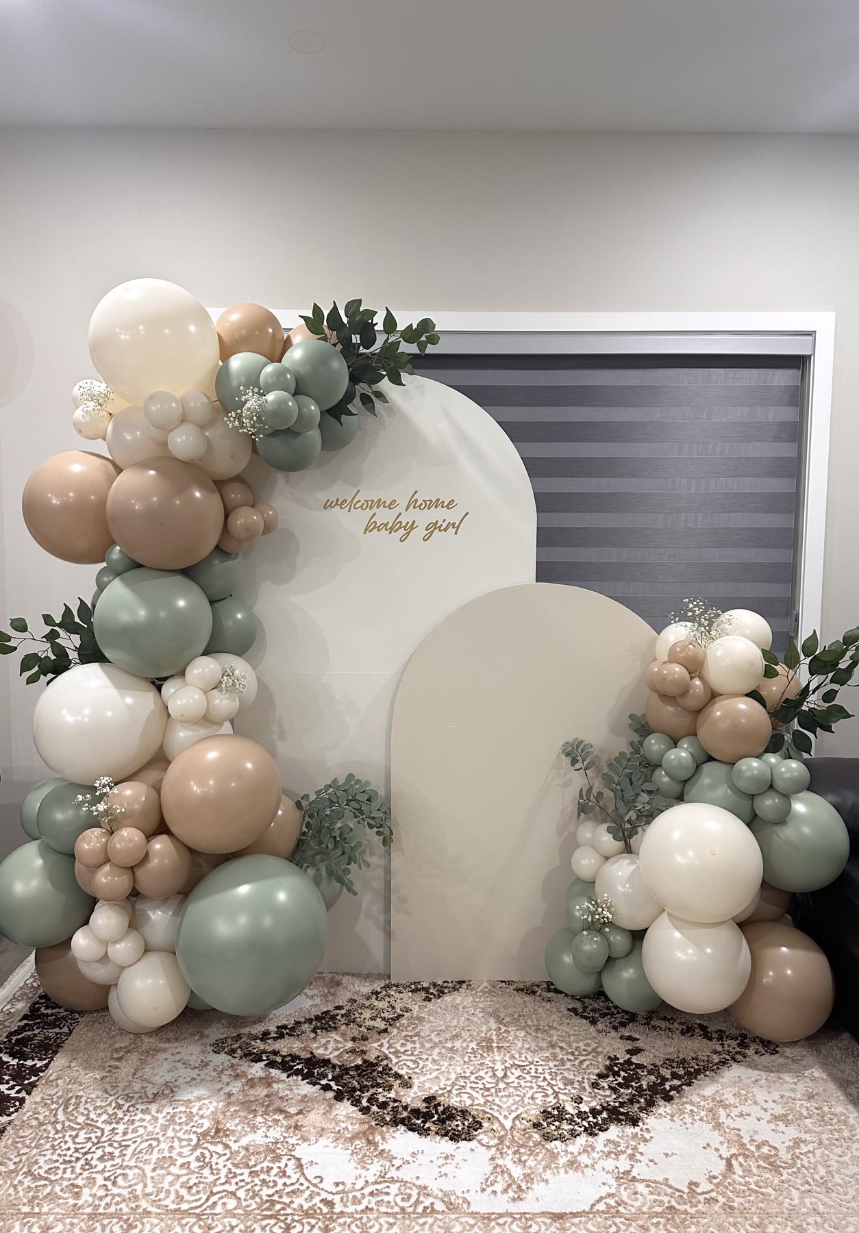 Sage and cream balloon garland with two arched backdrop panels, Winnipeg