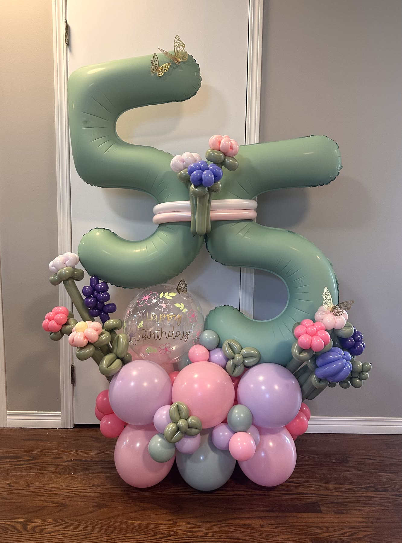Sage green balloon number stack with floral accents, Winnipeg