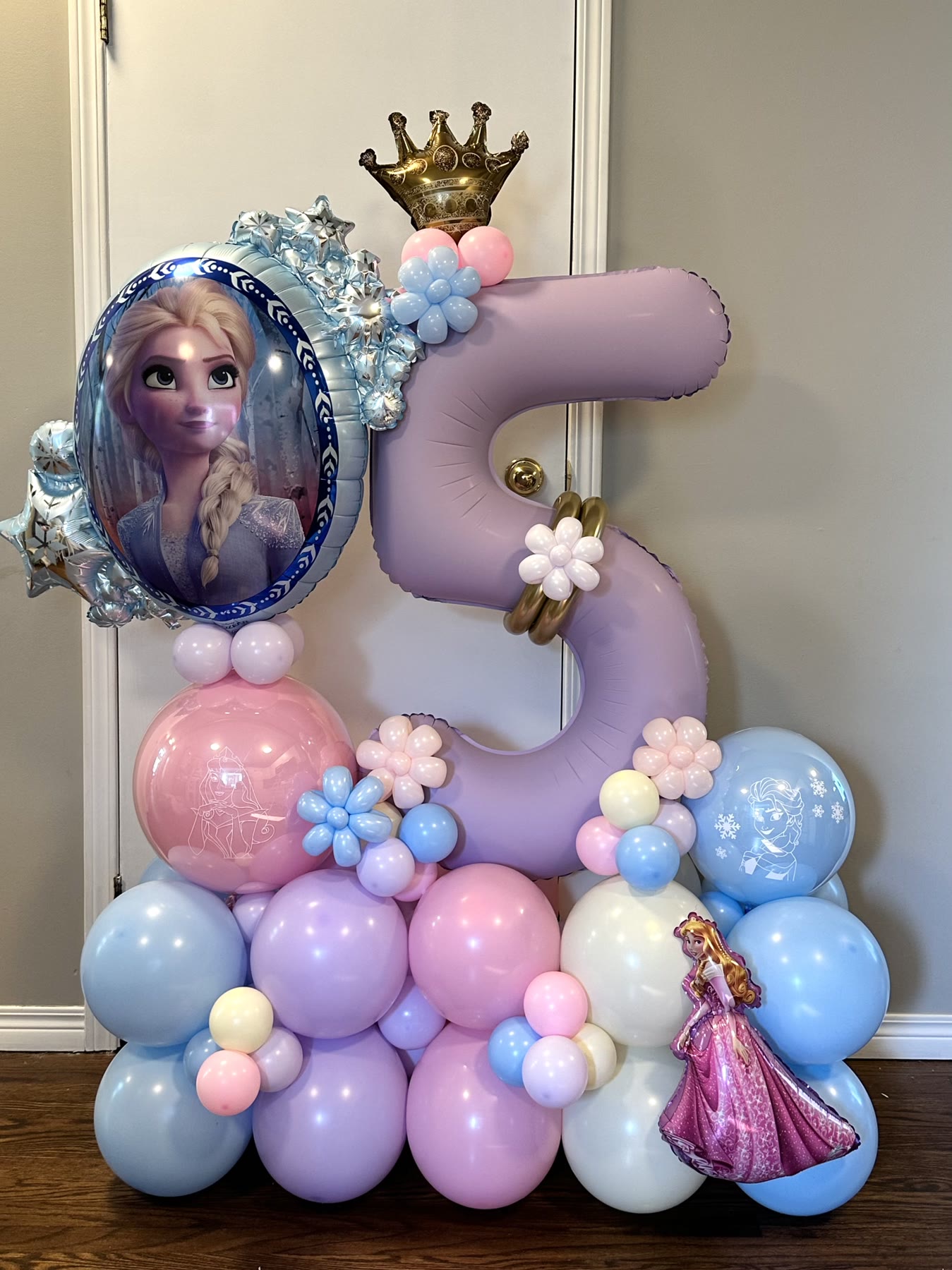 Lilac number five balloon stack with a gold crown and character balloons, Winnipeg