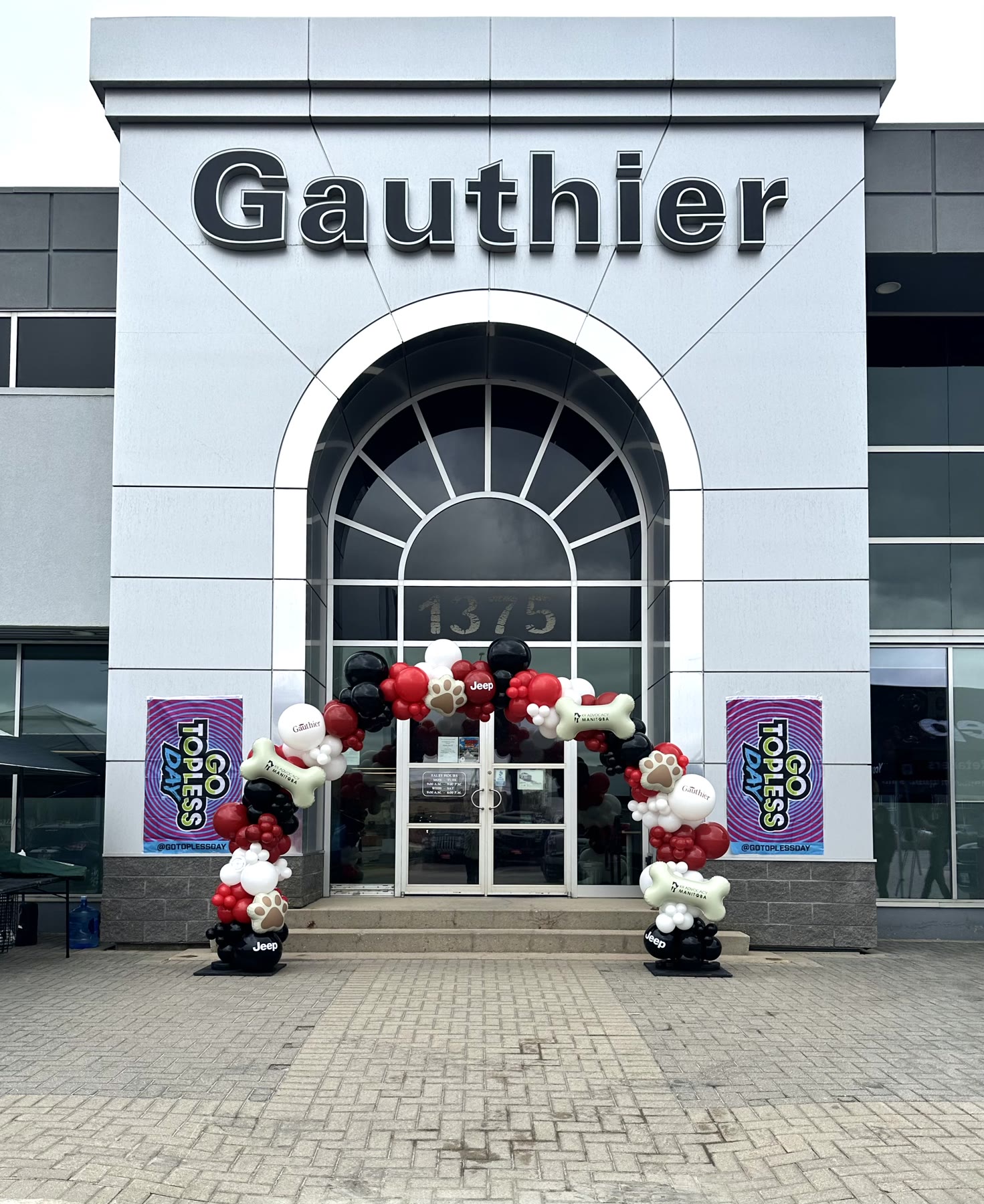 Black and white balloon column at the entrance of a Winnipeg retail store